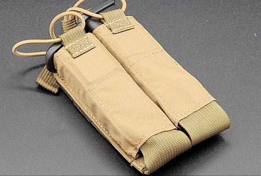 Tan tactical magazine pouch on a gray background