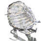 Camouflage backpack on a concrete floor