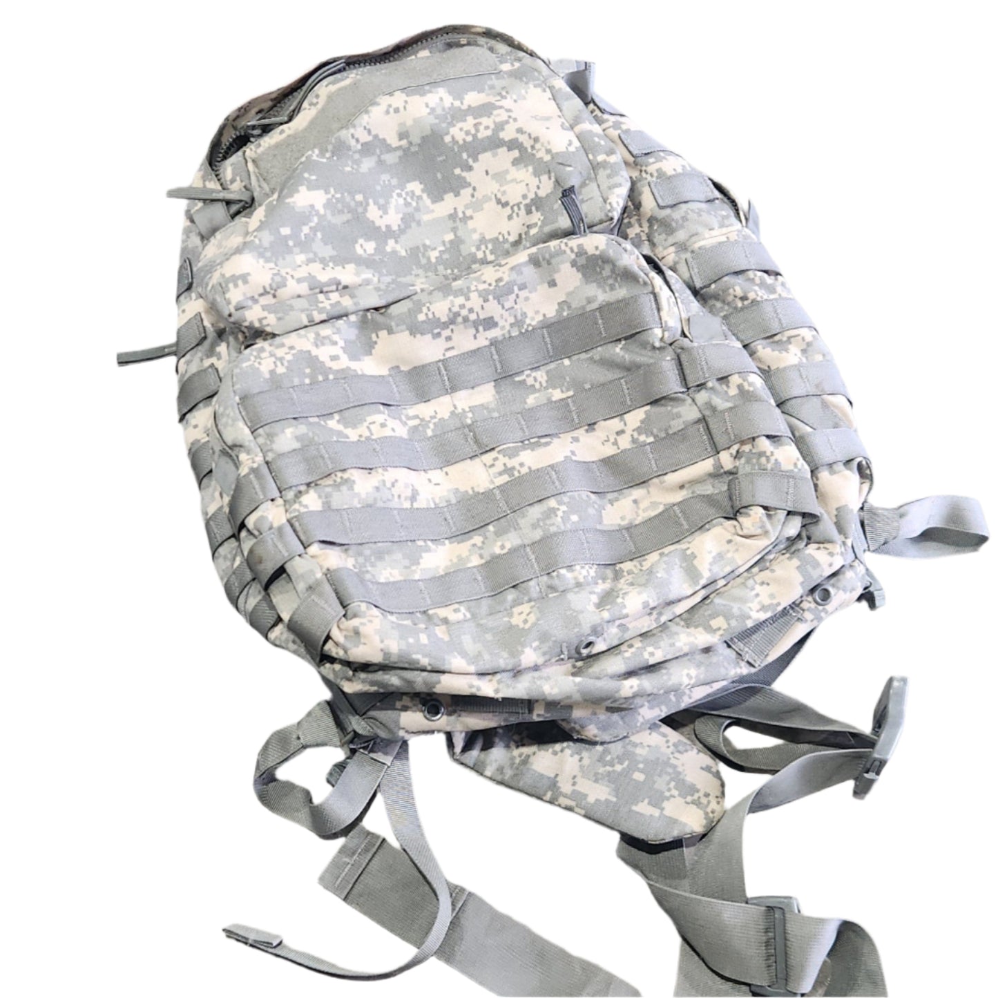 Camouflage backpack on a concrete floor