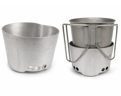 A silver aluminum camping pot shown in two views: disassembled on the left and assembled with its metal stand and handle on the right, set against a plain white background.