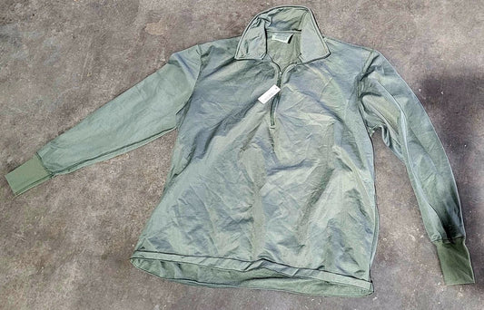 Green jacket on a gray concrete surface