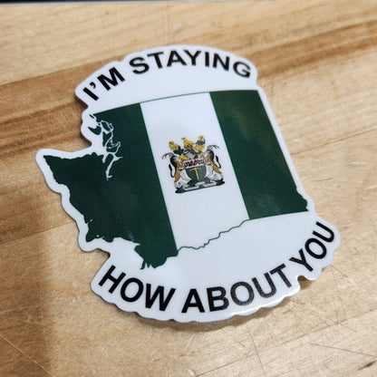 Sticker with text and a logo on a wooden surface